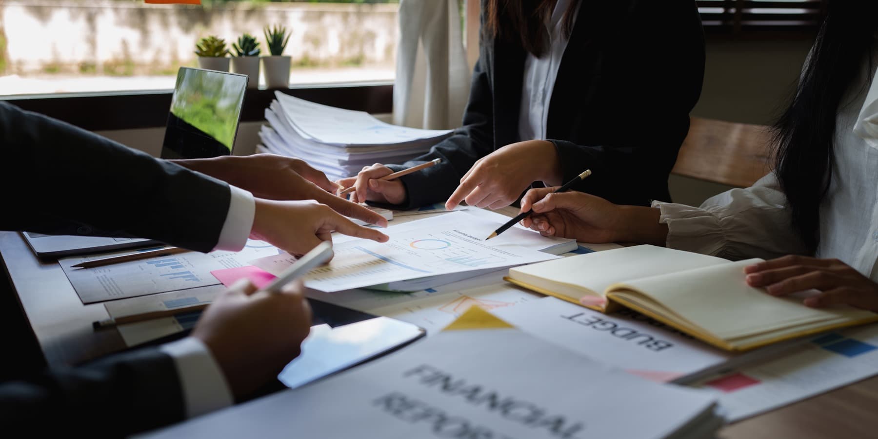 Professionals reviewing transaction information